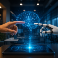 A human hand and a robotic hand reach toward a glowing digital brain hologram inside a modern office, symbolising enterprise artificial intelligence, human AI collaboration, and next generation AI innovation.